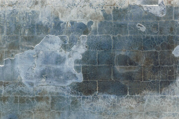 Abstract blue background. Cracks. The texture of the old surface. Cracks in the old plaster. Old texture. Grunge texture. Blue grunge background.