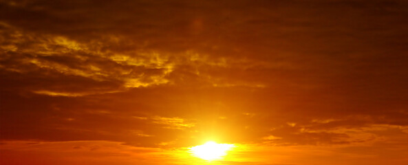 Naklejka na ściany i meble Scenic of the sunrise and cloud on orange sky. Wide photo.