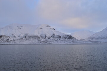 Sunset reflections over the frozen Arctic Norwegian Archepelago of Svalbard, Norway