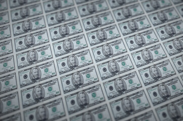 50 US dollars bills printed in illegal money production conveyor. Collage of many fake bills....