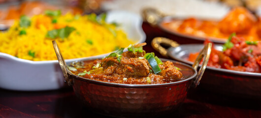 assorted indian curry and rice dishes