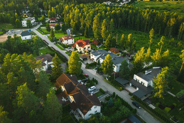Aerial view of private sector in european city. Luxury exterior. Green trees. Cars and houses.