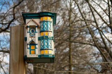 A Detailed Birdhouse Fashioned to Look Like a Real House