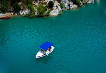 Boat drives on the river through the canyon. Grand Canyon du Verdon, France