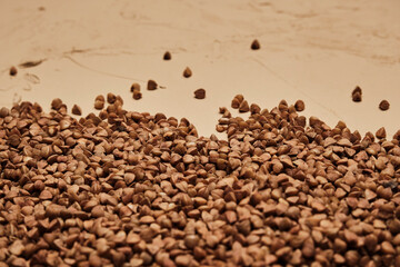 buckwheat on a backdrop, selective focus. rustic buckwheat background. buckwheat on a floor for instagram.