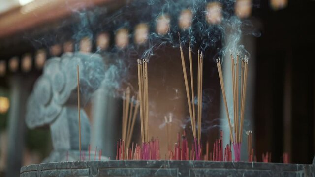 incense sticks is burning in asian buddhist temple