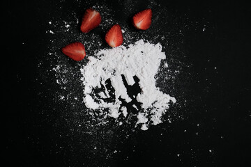Kitchen table with products, top view. Strawberry and flour. Top view in frame only ingredients.