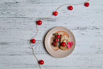 pork steak, grilled and served with cherry tomatoes on white wood table