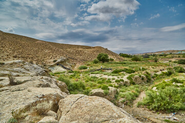 view of the mountains and the dry polluted riverbed in the highlands of Asia