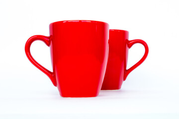 Red mug. Two red cups isolated on a white background. - 376752315
