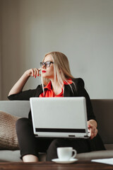 woman typing on laptop working from home