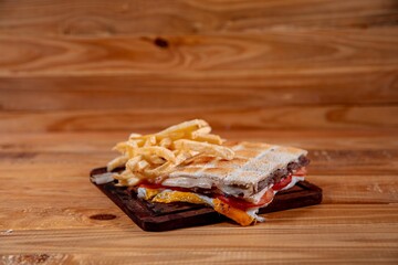 Meat sandwich with wood backgound