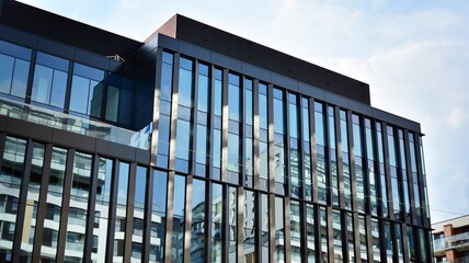 Bottom view of glass silhouette of skyscraper. Business building. Skyscraper with glass facade. Modern building in business district. Concepts of economics, financial, future.   