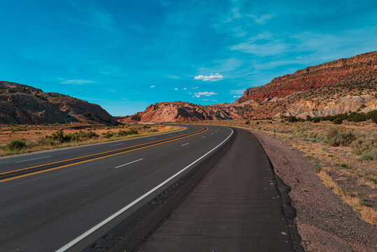 Road trip in Arizona desert. Background of road and sky.