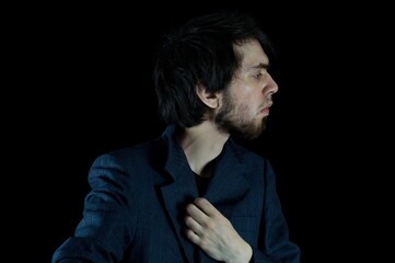 Young man posing for a side portrait shot