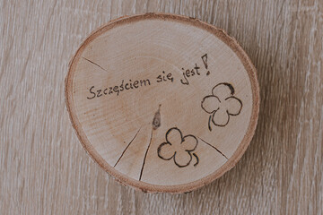 original round mug coaster made of birch wood with a positive inscription in Polish