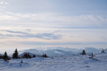 Beautiful winter mountain views at sunset during a snowshoe hike along the red ridge trail in the Low Tatras, Slovakia 
