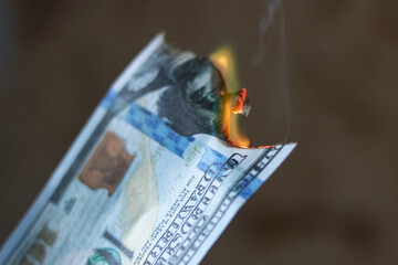 Burning dollar bill close up, copy space
