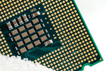 Close-up macro of a CPU unit processor on silica sand