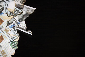 The remains of burnt dollar bills close up