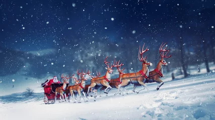 Fotobehang Santa claus in a sleigh ready to deliver presents with sleigh © alphaspirit