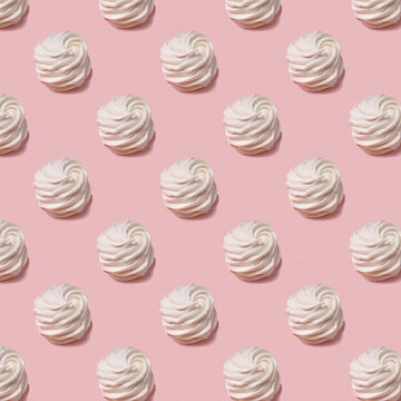 Seamless pattern of sweet yellow marsh-mallows  with one white marsh-mallow against pink backround. Soft light.