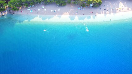 Beautiful Punta Rata beach in Brela, Croatia, aerial view. Adriatic Sea with amazing turquoise clean water and white sand on the beach. 