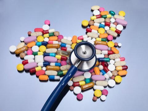 Stethoscope on pills in China map shape