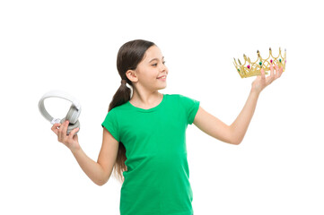 queen of music. portrait of cheerful girl isolated on white. happy childhood. small girl choose between crown and headphones. being a super star. best hit list. royalty free music. pop princess