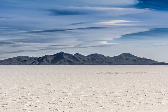 View of salt flats and distant mountains, Salar de Uyuni, Southern Antiplano, Bolivia, South America