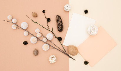 Autumn background with fall decor, blank stationary template, invitation mock up, empty paper card with copy space for text from top on beige background. Top view. Flat lay. Fall winter seasons