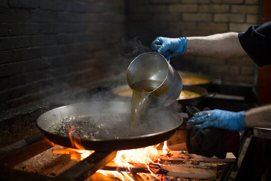 Person Making Paella