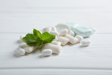 mint chewing gum and mint on the table. Fresh breath, oral care

