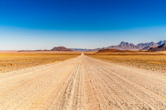 Road ahead from Windhoek to Walwedans in the Namibrand Nature Reserve , Namibia