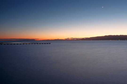 Wooden pier at dusk, Trabucador Isthmus, Alfacs Bay, Tarragona, Catalonia, Spain