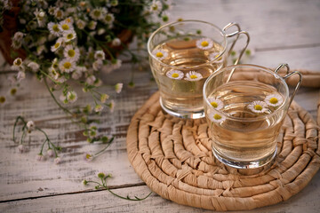 fresh organic chamomile tea with glass cups