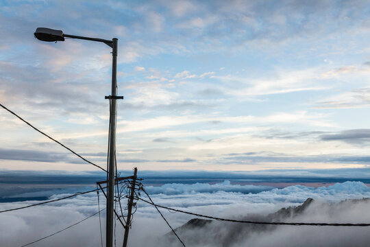 Lamppost and telephone wires above the clouds, Mussoorie, Uttarakhand, India