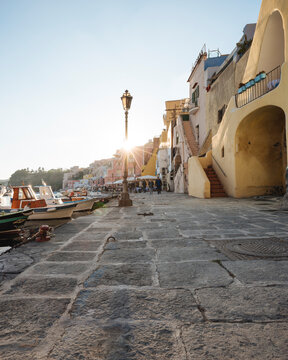 Waterfront restaurants and harbour boats at Procida island, Campania, Italy
