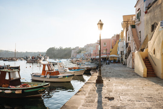 Waterfront restaurants and harbour boats at Procida island, Campania, Italy
