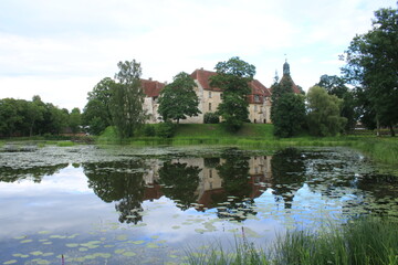 Fototapeta na wymiar The old beautiful Jaunpils castle is landmark in the territory of Latvia on summer day 2020