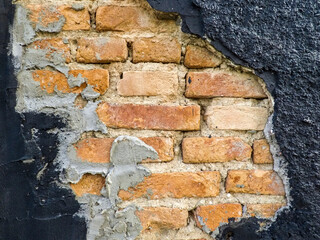 Damaged and exposed brick wall in Brazil