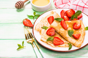 Crepes with fresh srawberries and honey.