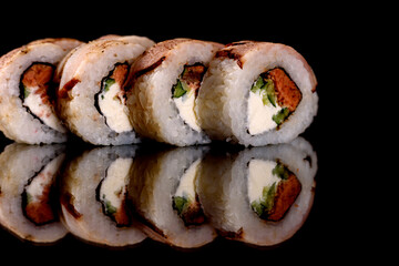 Fresh sushi rolls prepared from the best varieties of fish and seafood