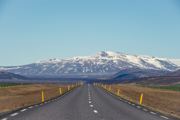 Road leading to a snowy mountain in Iceland.