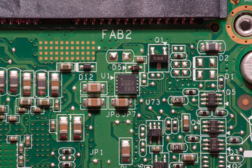 macro photo of a printed circuit board with chips