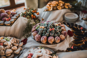 Table with food for the holiday. Cuisine. Culinary Buffet. Dinner Catering. Dining Food. Celebration Party. Concept wedding birthday. Sweet pastries desserts