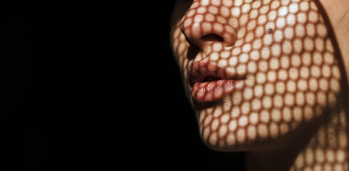 woman with shadows on face. Sensual. Woman shadow. Portrait. 
