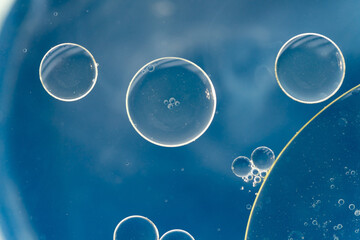Oil drops on the water - Abstract background blue macro photography