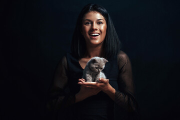 Obraz premium Woman at home holding her lovely cat. Kitten. Happy. Smile woman. 