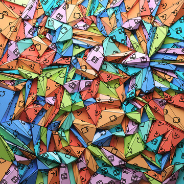 Colorful paper with printed icons folded into triangles